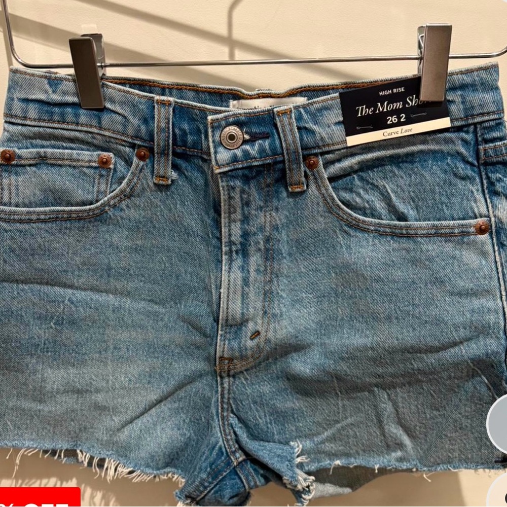 Light Blue Jean Shorts with Frayed Edges and Cut-Off Style